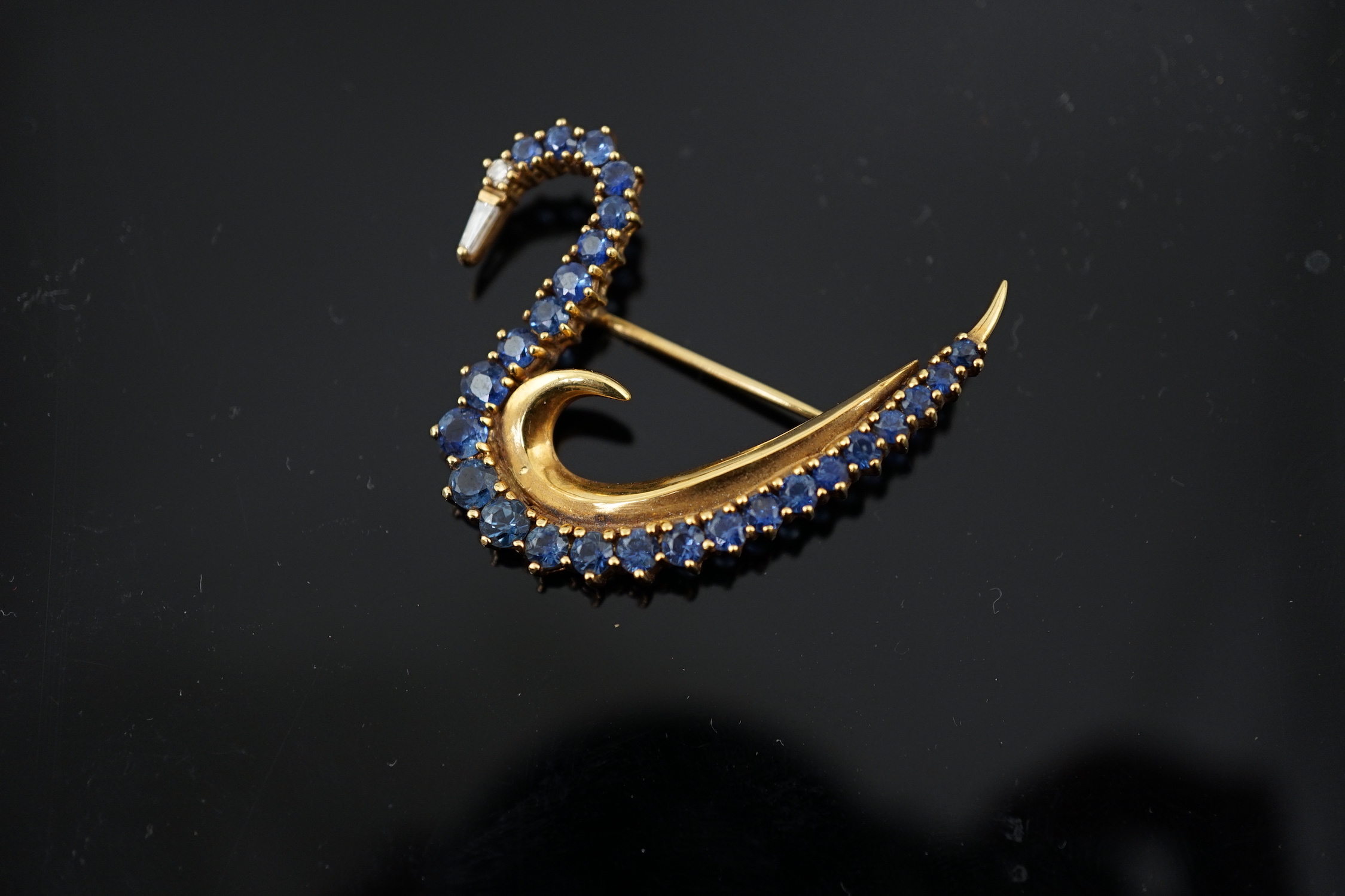 A 1990's 18ct gold, sapphire and diamond cluster brooch, modelled as a swan